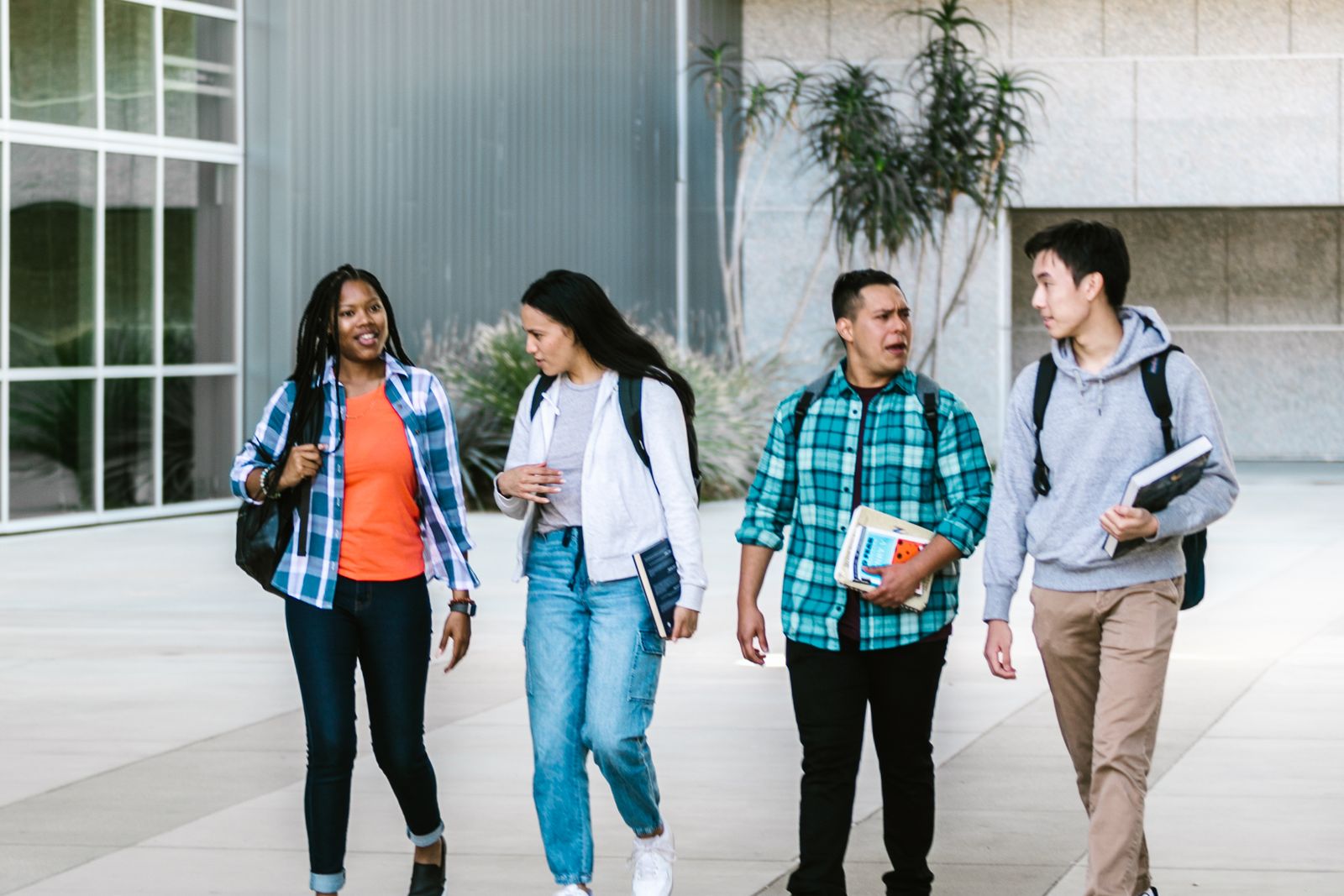 A Group of College Students Walking at the Campus