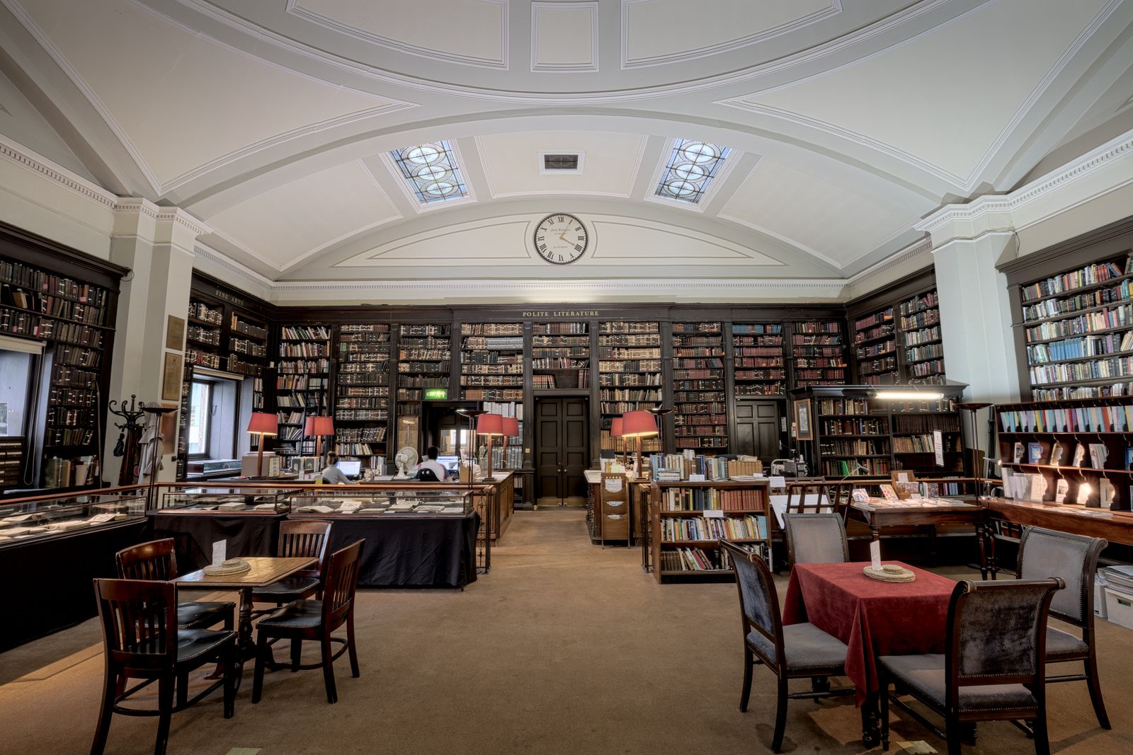 A historic library reading room lined with shelves