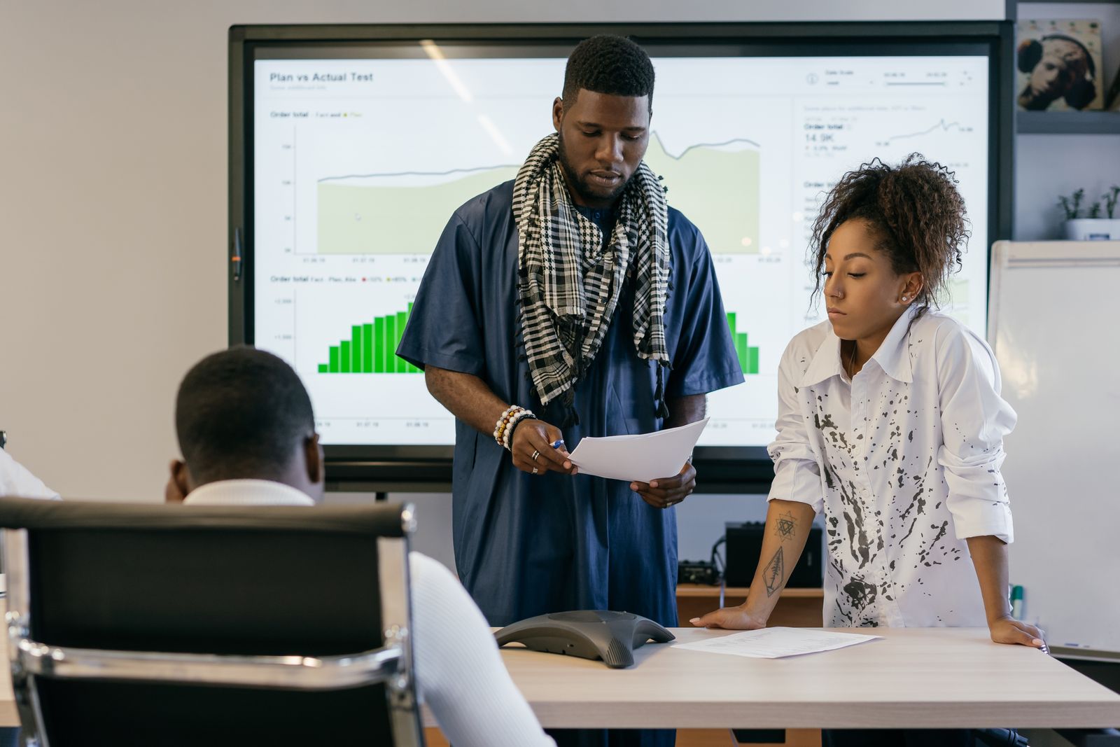 Couple Giving Presentation at Office