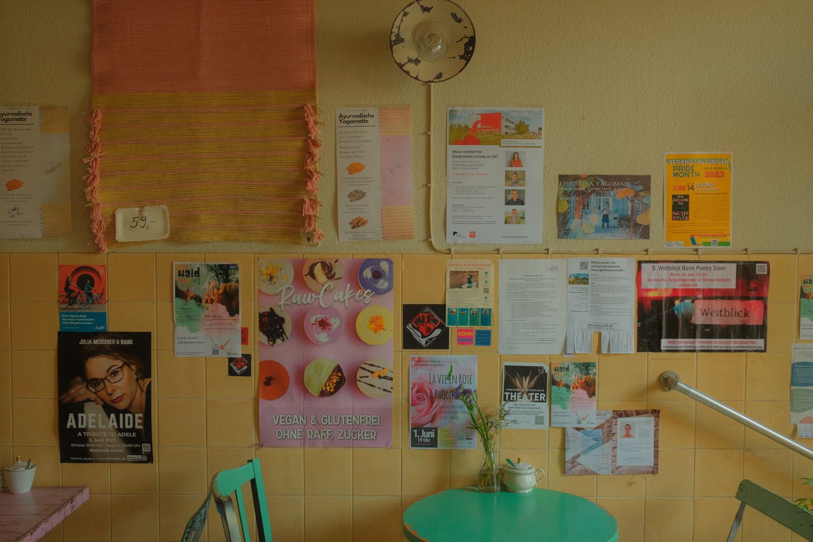 A noticeboard covered in event flyers