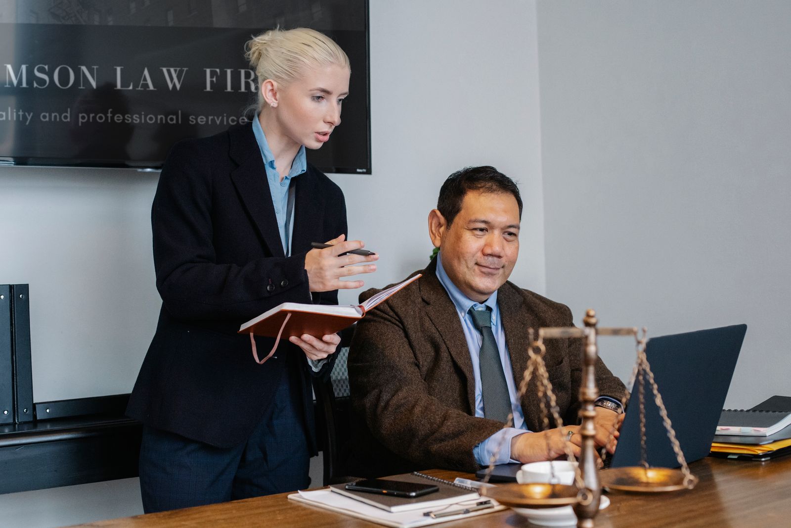An attorney working at a laptop in a law office