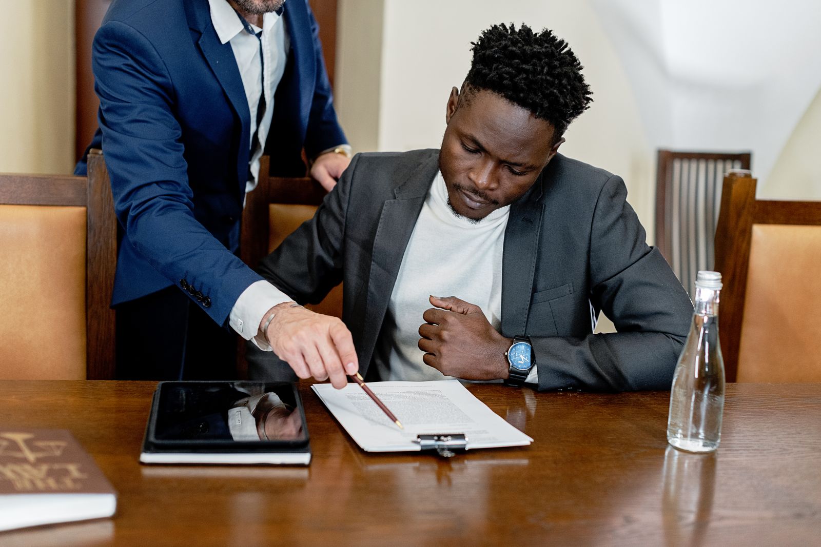 Attorneys reviewing documents together at a conference table