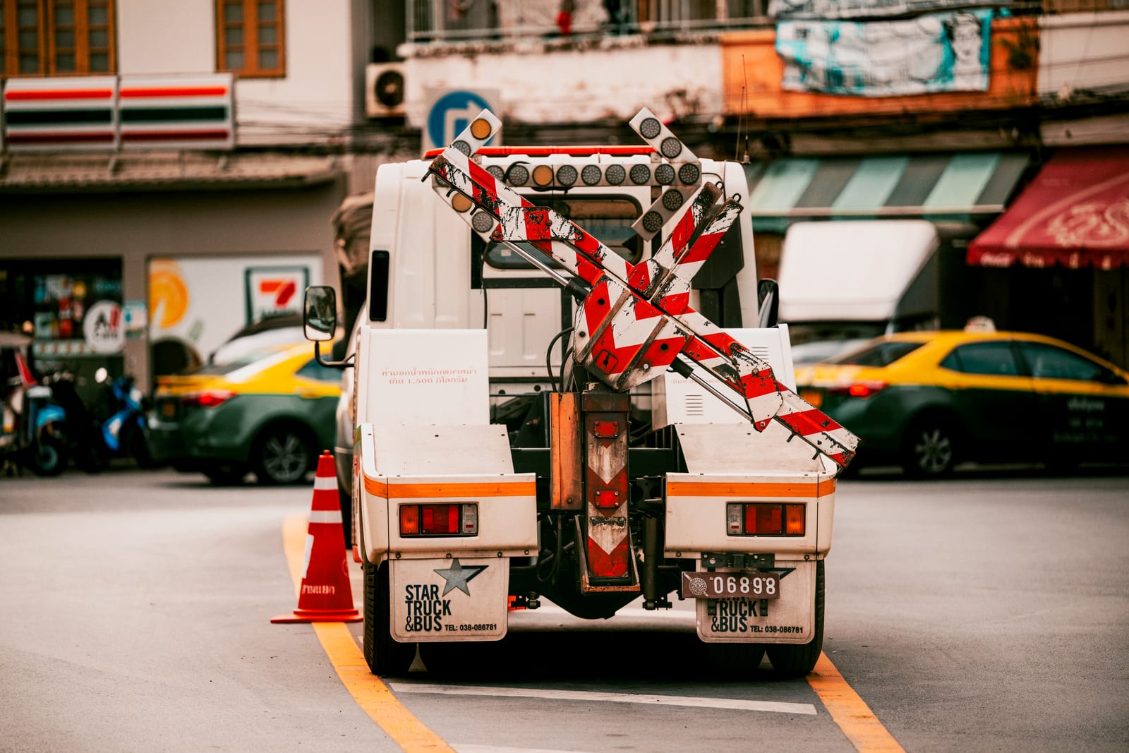A tow truck at work on a city road