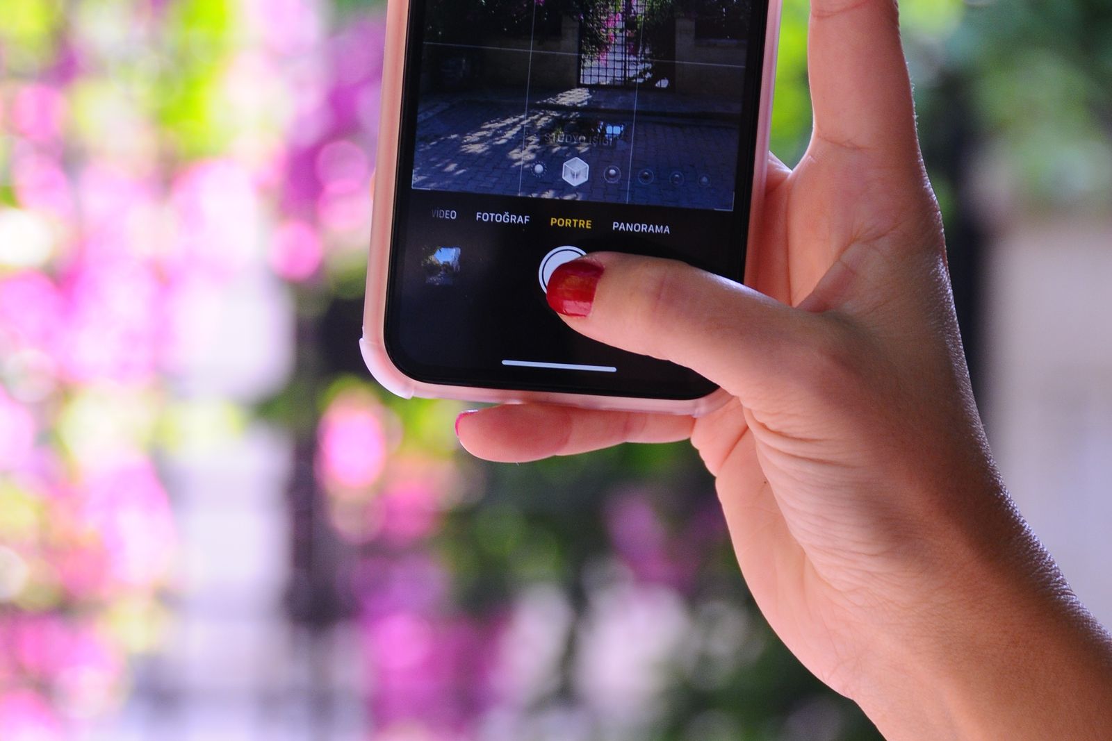 Woman reviewing a photo feed on her smartphone