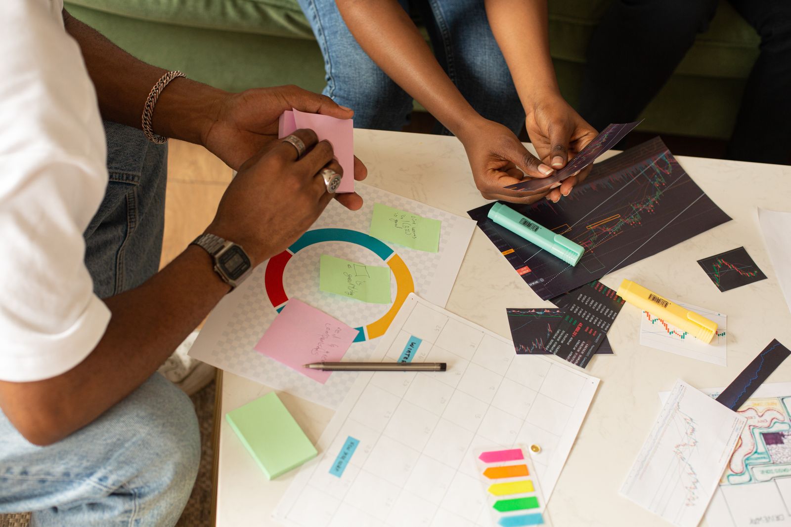 Hand mapping a content plan on a corkboard of sticky notes covering SEO, branding, and planning