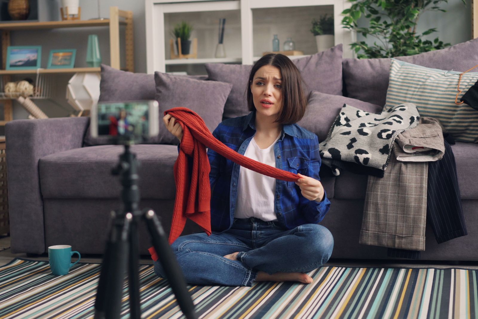 Woman Sitting on Floor and Recording Video